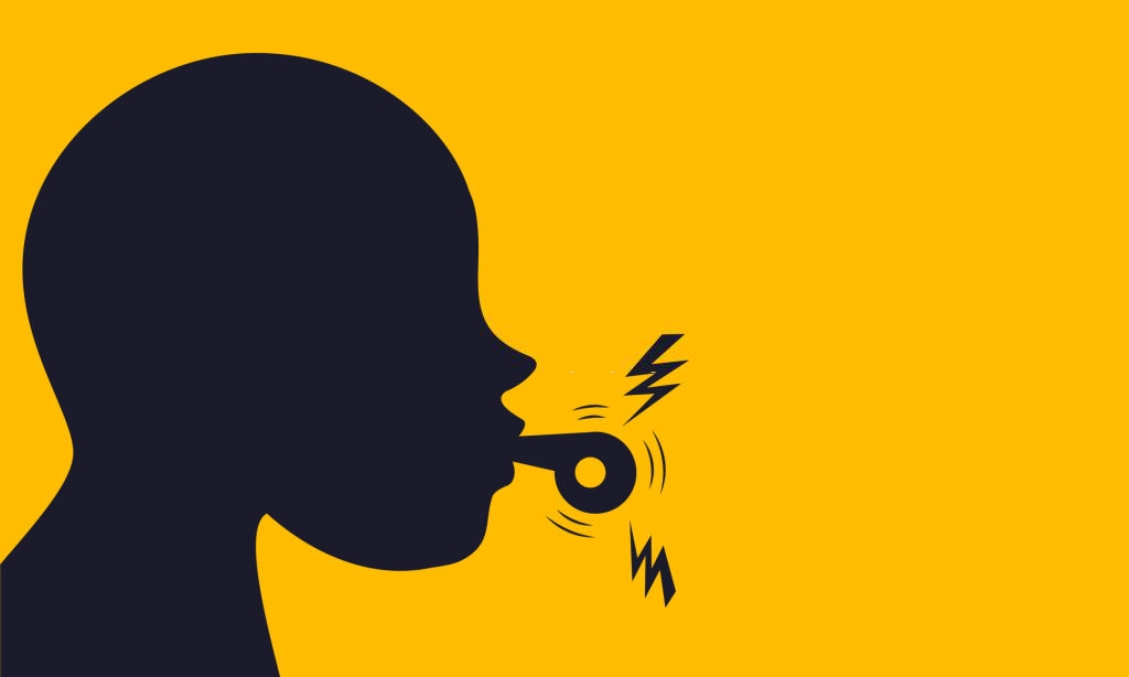 A person blowing a whistle